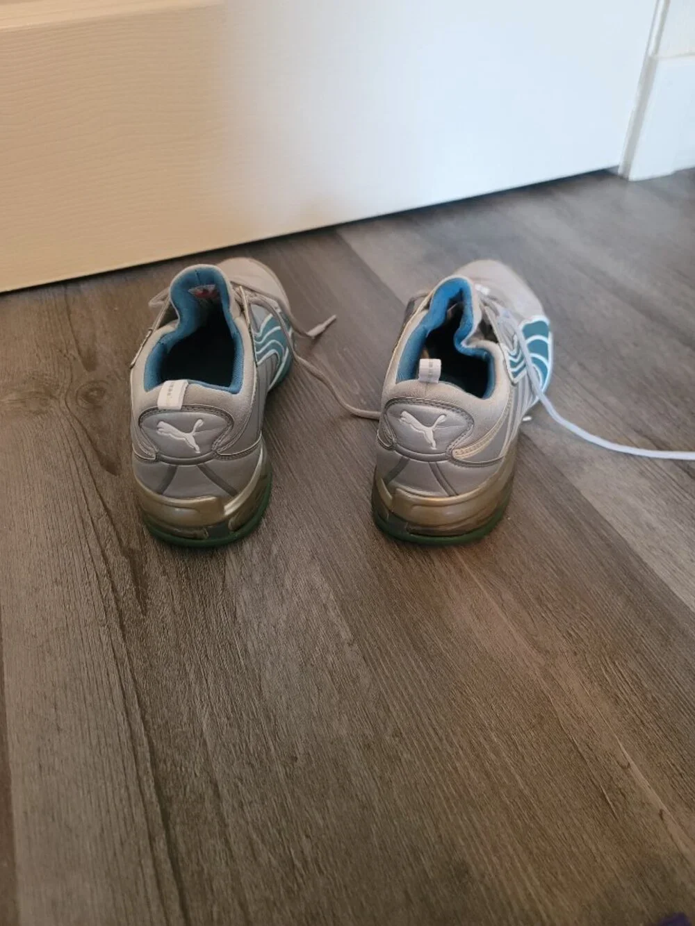 Womens grey and blue puma tennis shoes - has damage - size 10